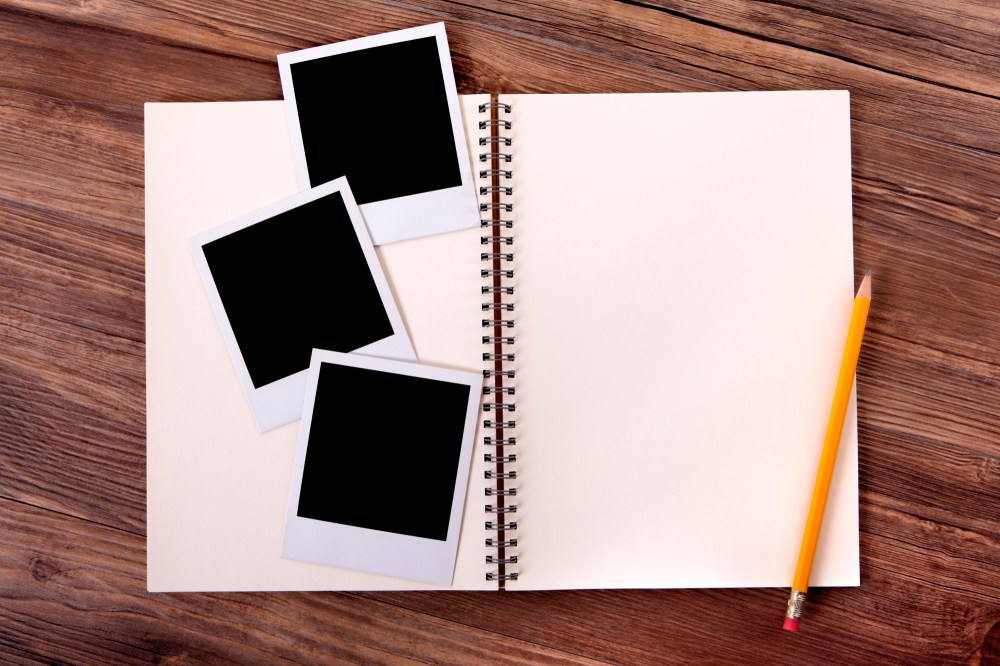 Blank notebook with some photographs