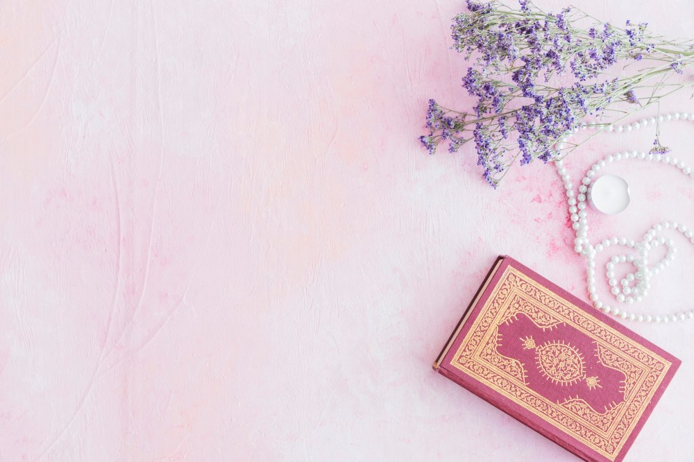 Koran book with small purple flowers 