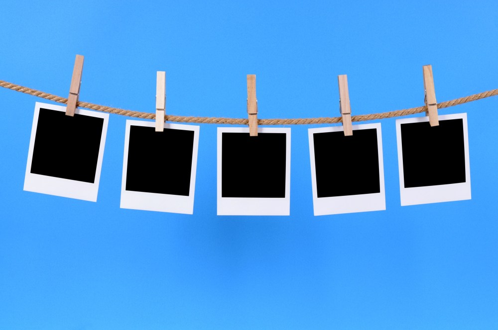 Polaroid photos on a string