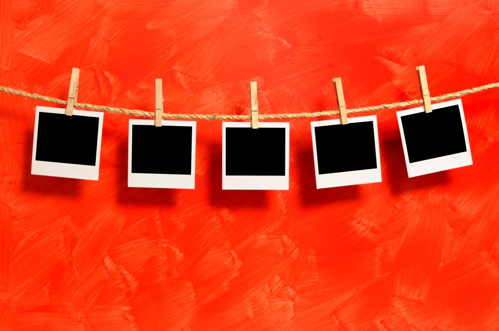 Polaroid photos on red background 