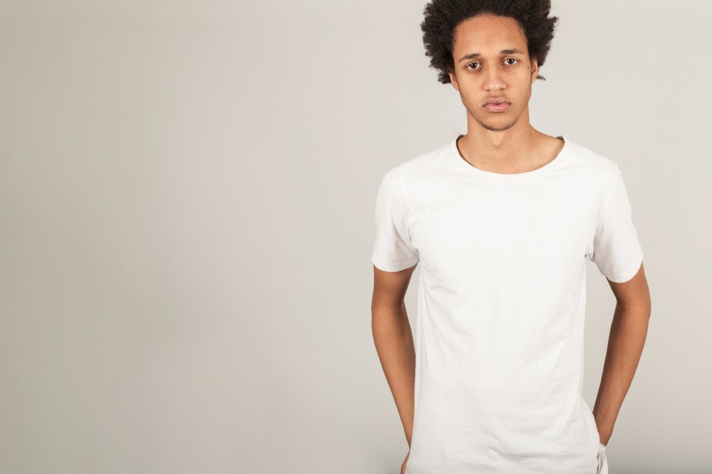 Serious young man in t-shirt