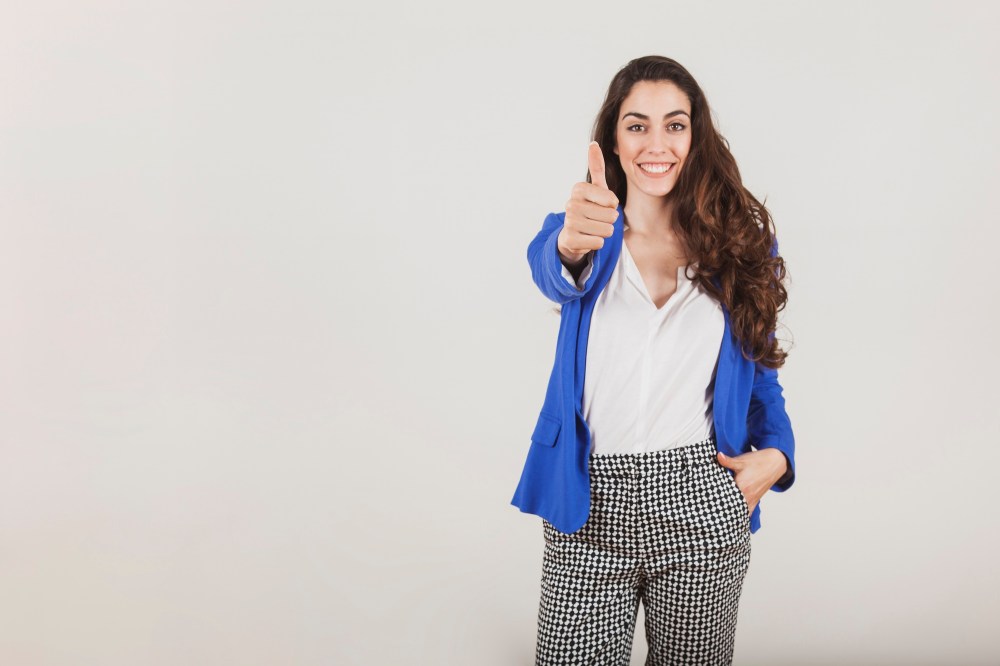 Smiling worker showing a positive gesture