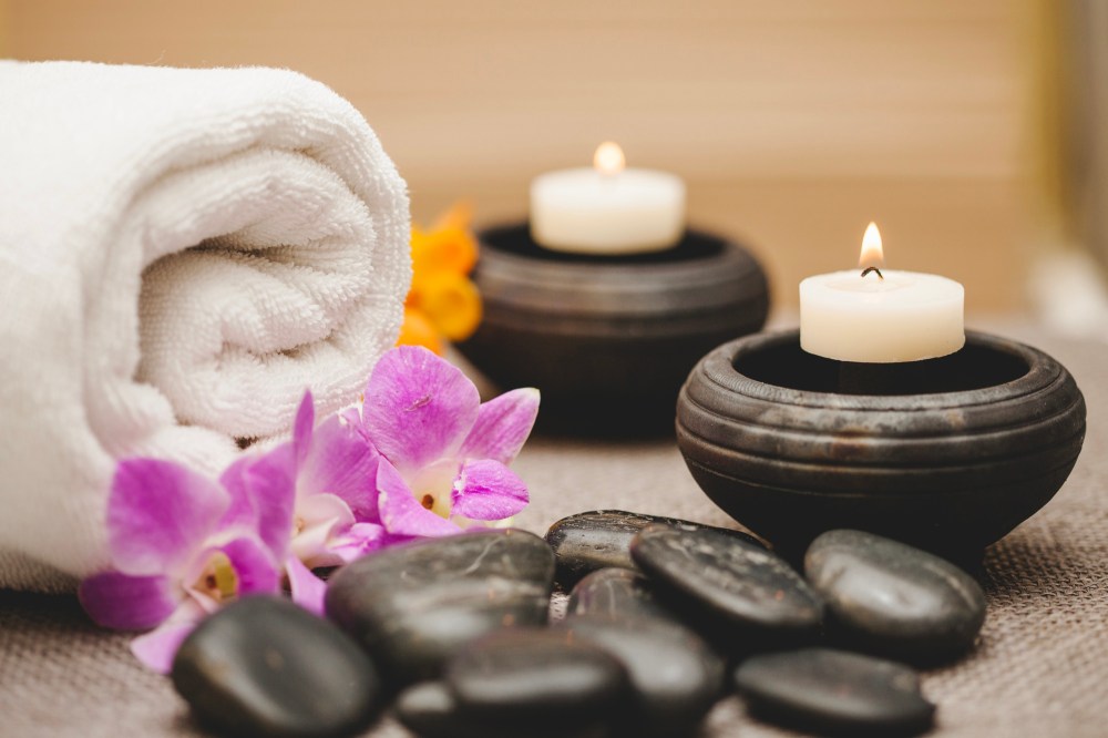 Towels, candles, stones and flowers