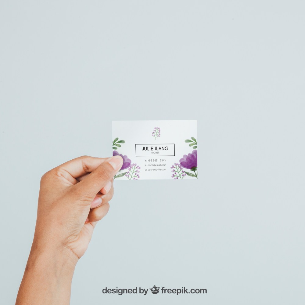 Hand holding business card's mock up 