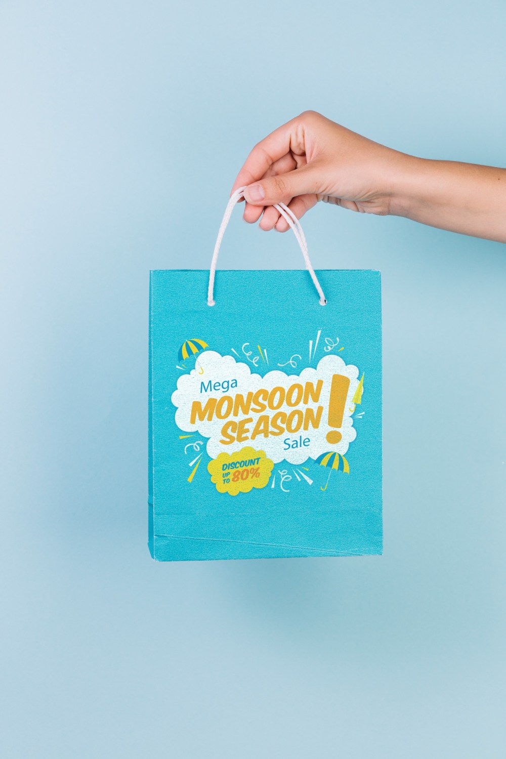 Hand holding shopping bag mockup