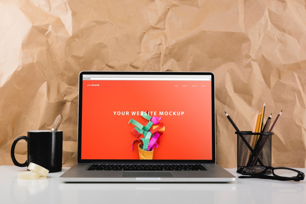 Website mockup with laptop on desk