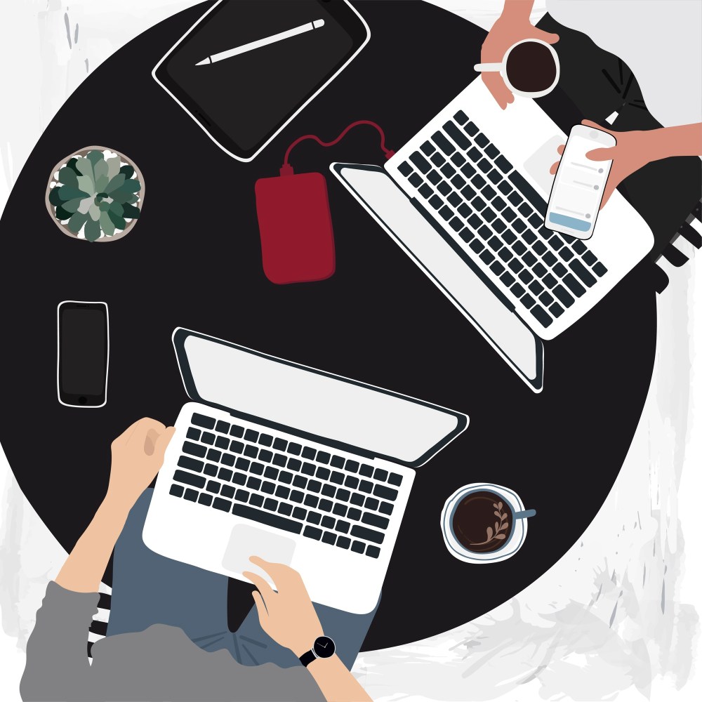 People working on laptops in a cafe