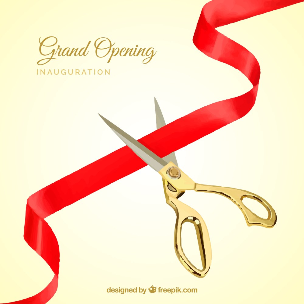 Red ribbon background with golden scissors