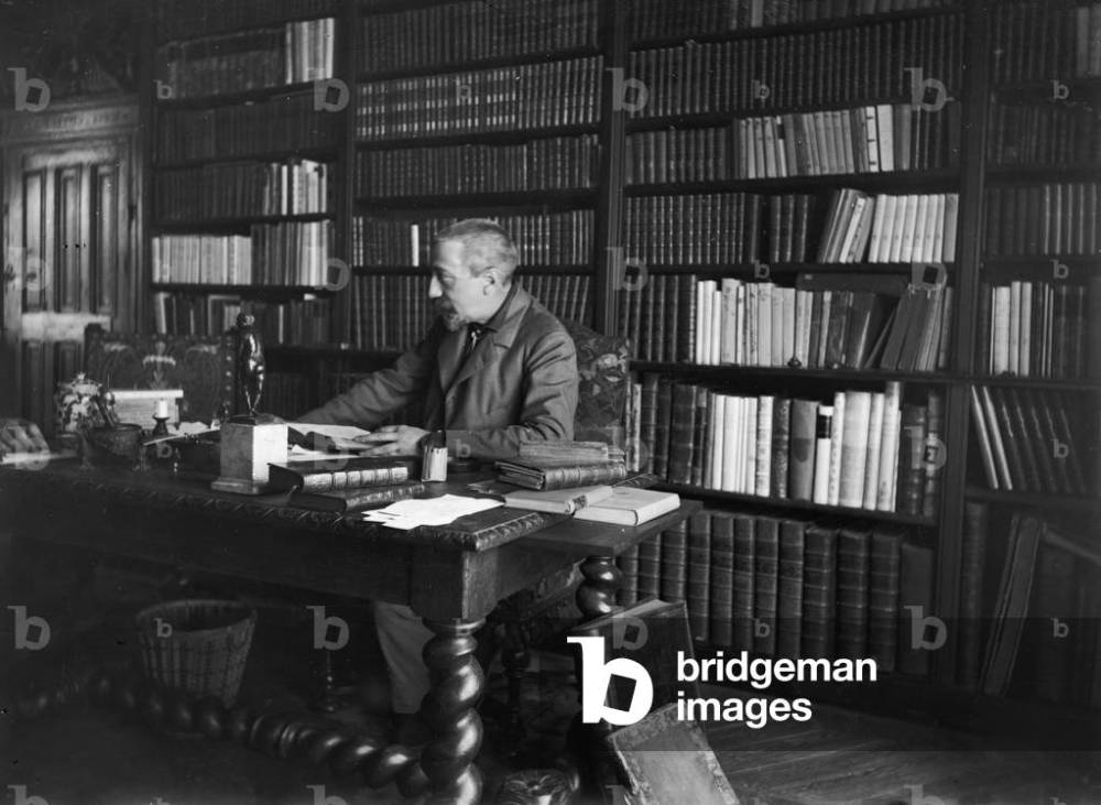 Image of Portrait of Anatole France sitting in his study (b/w photo) by Dornac (Paul Francois Arnold Cardon) (1859-1941)