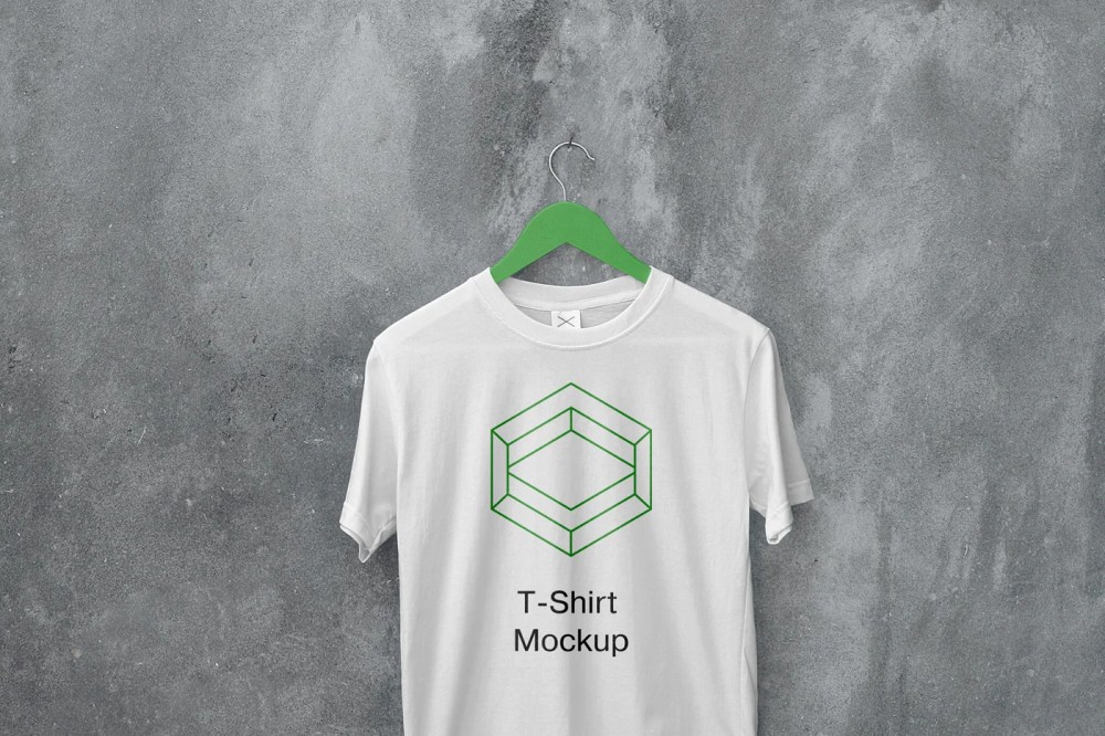 a white t - shirt with a green t - shirt mockup hanging on a