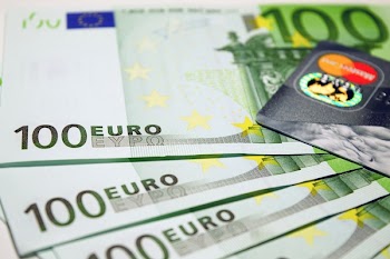 100 Euro Bills Beside Mastercard