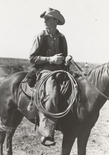 1939. 
Cowboy on horse with equipment on cattle ranch near Spur, Texas. 
Photographer Lee Russell