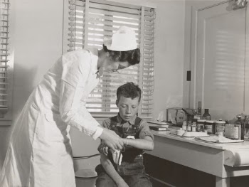 1939 - Farm Security Administration (FSA) camp at Farmersville, Tulare County, for migratory agricultural laborers. Migratory boys come to the clinic for attention of the resident nurse of the Agricultural Workers' Health and Medical Association (FSA).
Photographer - Dorothea Lange 