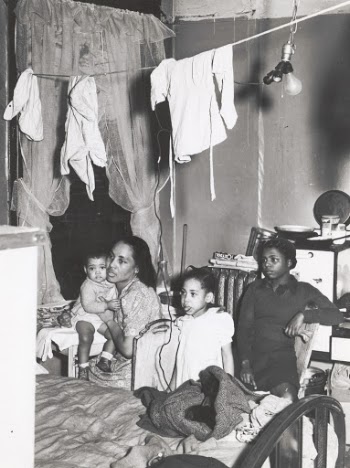 1941 - African American family living in crowded quarters, Chicago, Illinois.
Photographer - Russell Lee