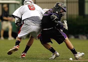2 Men Playing Football during Daytime