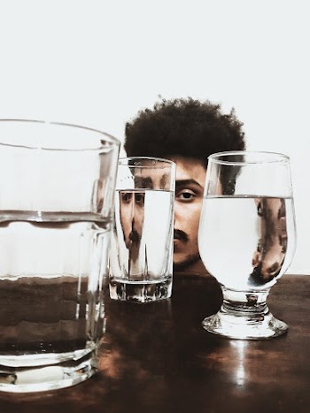 3 Clear Drinking Glasses on Brown Wooden Table