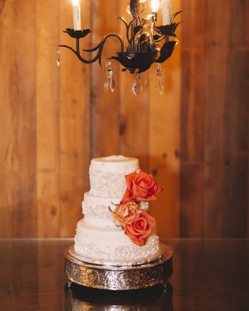 3-tier White Coated Cake With Orange and Yellow Roses