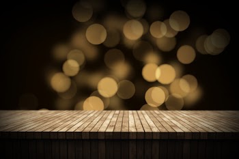 3d christmas background with wooden table looking out to bokeh lights Free Photo