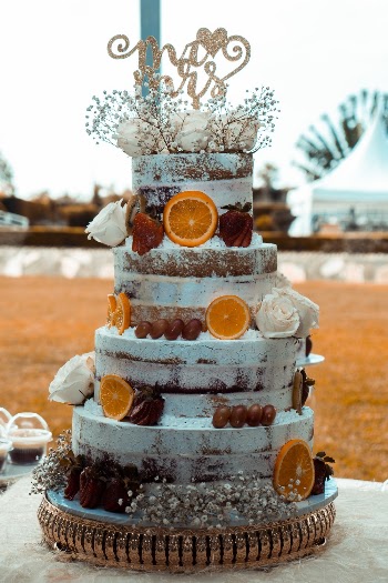 4-tier Cake With Sliced Oranges on Surface