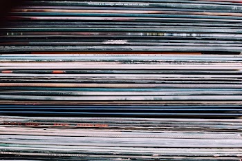 A background consisting of a stack of records in the city of Nancy, France