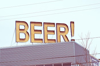 A beer sign with small | Free Photo - rawpixel