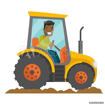 A black happy farmer in tractor on a rural farm field