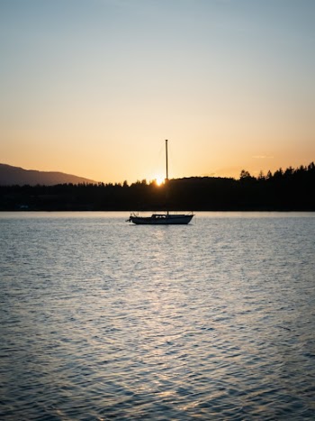 a boat floating on top of a large body of water