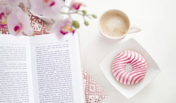 A book, cup of coffee and flavoured donut on Square White Ceramic Bowl