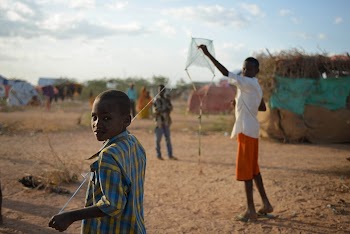 A boy flys his homemade | Free Photo - rawpixel