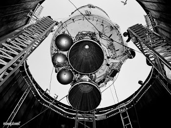 A Centaur second-stage rocket is lowered into.. | Free public domain photo - 441636