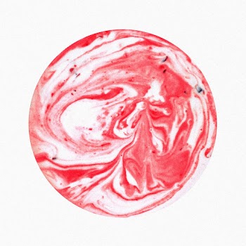 A circular artistic paint splashes