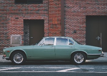 A classic green car is | Free Photo - rawpixel