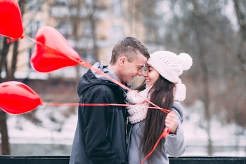 A couple with heart shape baloons 3