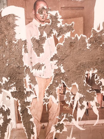 A Damaged Photo Of Man Wearing long-sleeved Shirt Standing Near A Table
