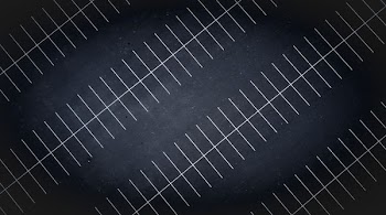 A drone view at night of parking lot lines