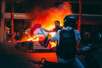 A fan celebrates after France wins the 2018 World Cup