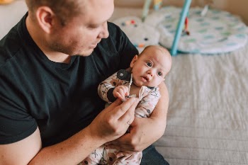 A Father Carrying His Baby