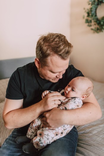 A Father Carrying His Baby