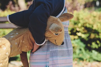 A girl holding plush Bambi