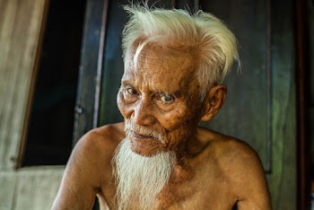 A Gray-Haired Old Man Without A Shirt