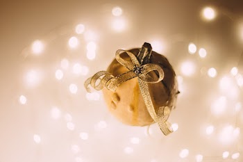 A halloween pumpkin with a spider jewel