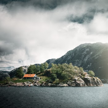 A House On An Island Surrounded by Trees
