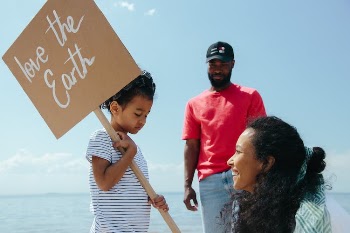A Kid Holding a Placard