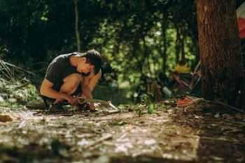 A Man Cutting Woods