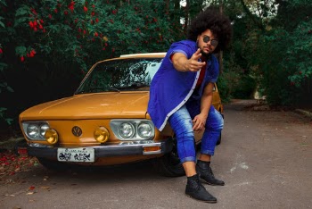 A man sitting at on a car 