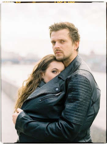 A Man Wearing a Black Leather Jacket Hugging Her Woman · Free Stock Photo