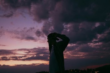 A Man Wearing Cap Standing Under Evening Sky · Free Stock Photo