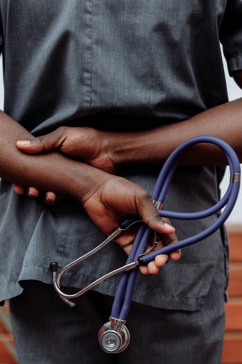 A Medical Person Holding a Stethoscope