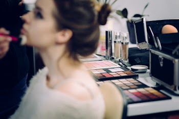 A model and a makeup artist at work