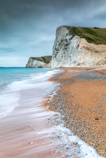A moody morning down at durdle door. The lack of sunrise light meant I tried out a few different kind of shots, utilising the waves on show to get some lovely trails looking towards bats head. You can't beat this place there is always a shot!